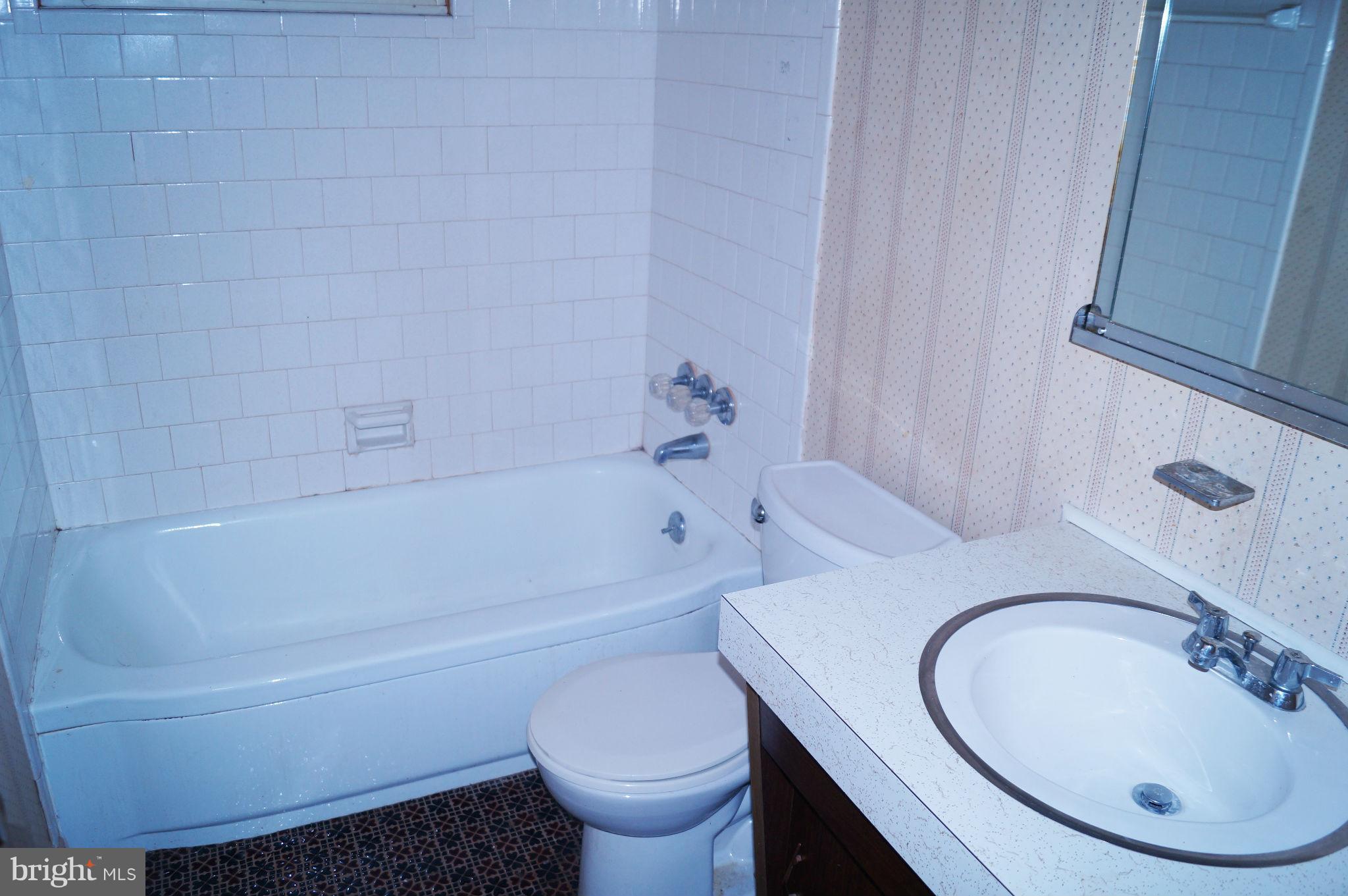 1319 Denbright Road Baltimore, MD 21228 - Photo 5 of 11 a bathroom with a sink and a toilet