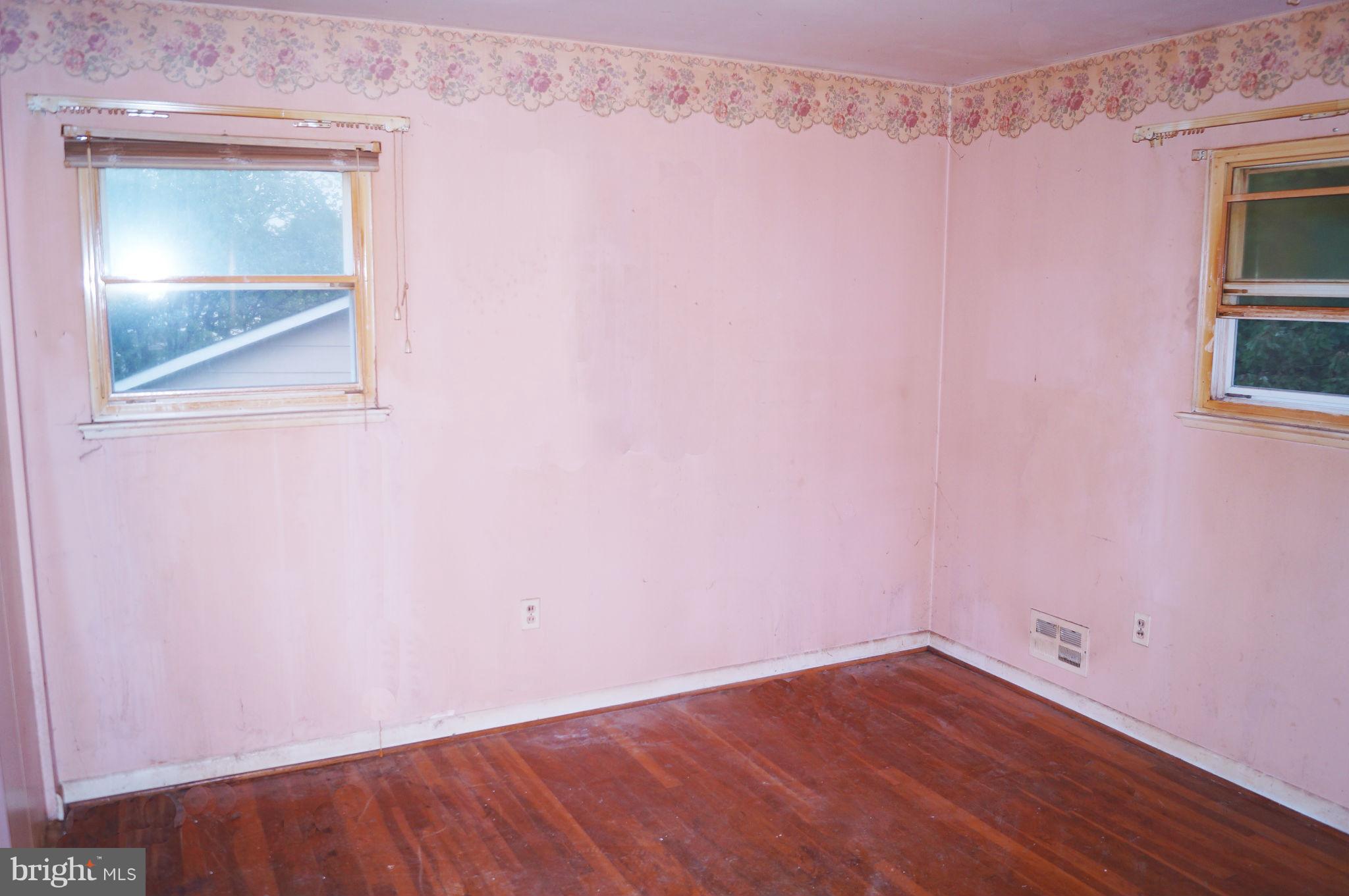 1319 Denbright Road Baltimore, MD 21228 - Photo 7 of 11 a view of a small space with wooden floor and a window
