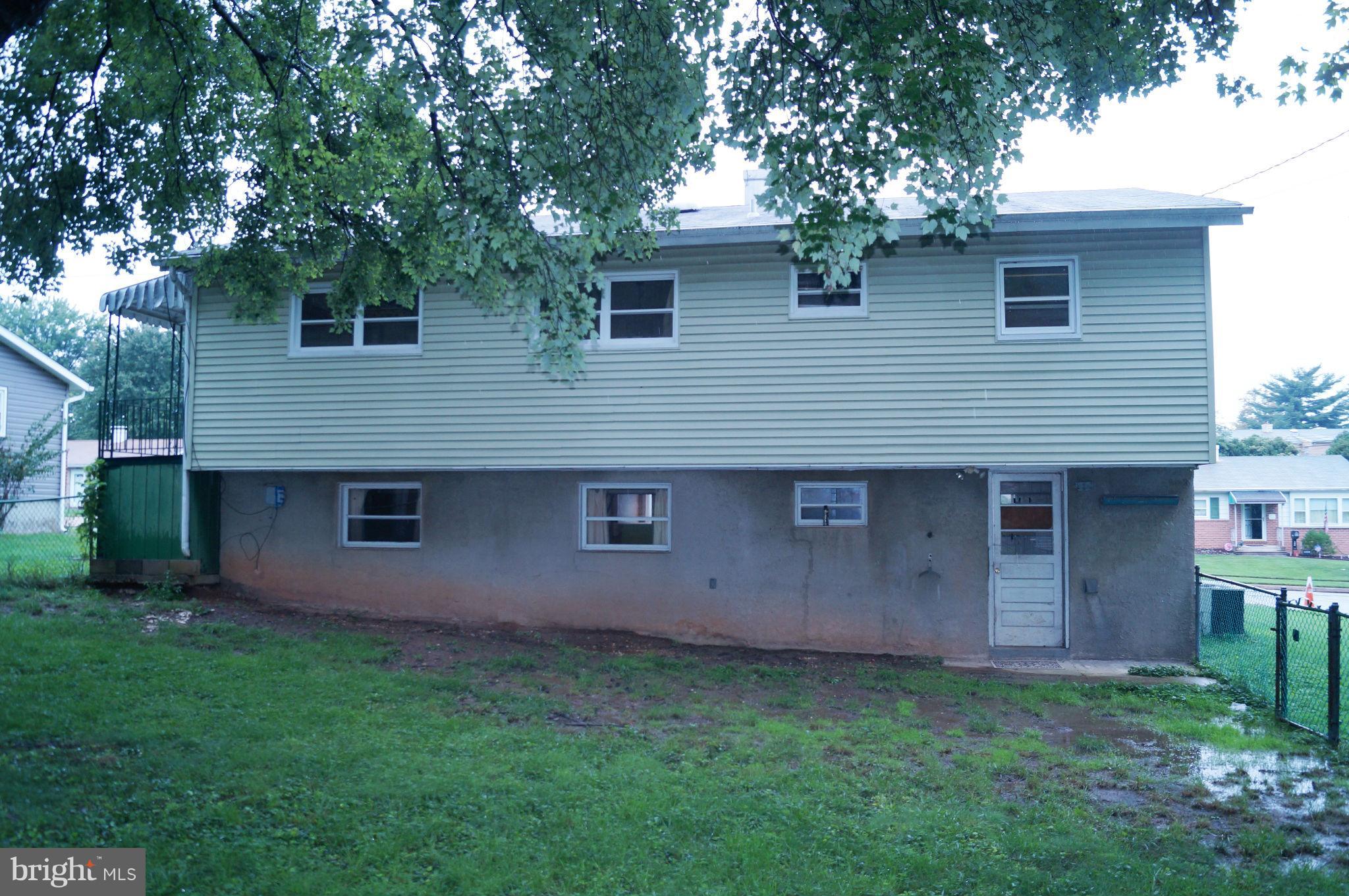 1319 Denbright Road Baltimore, MD 21228 - Photo 10 of 11 a view of a house with a backyard