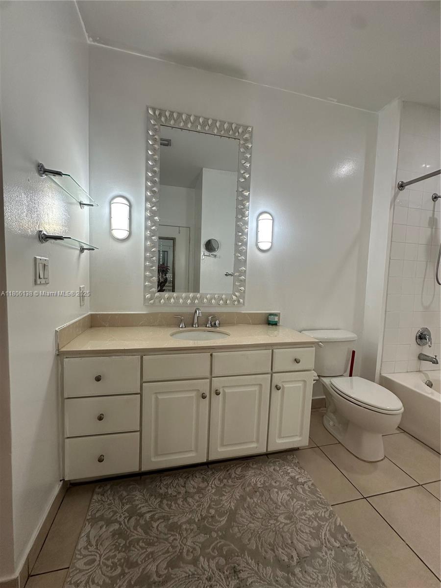 2001 Biscayne Boulevard, Unit 3503 Miami, FL 33137 - Photo 21 of 34 a spacious bathroom with a double vanity sink mirror and toilet