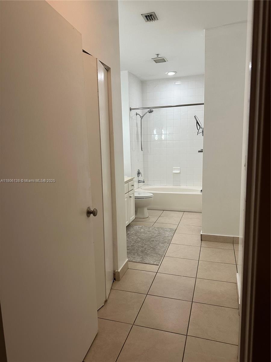 2001 Biscayne Boulevard, Unit 3503 Miami, FL 33137 - Photo 23 of 34 a bathroom with a glass door shower and a sink