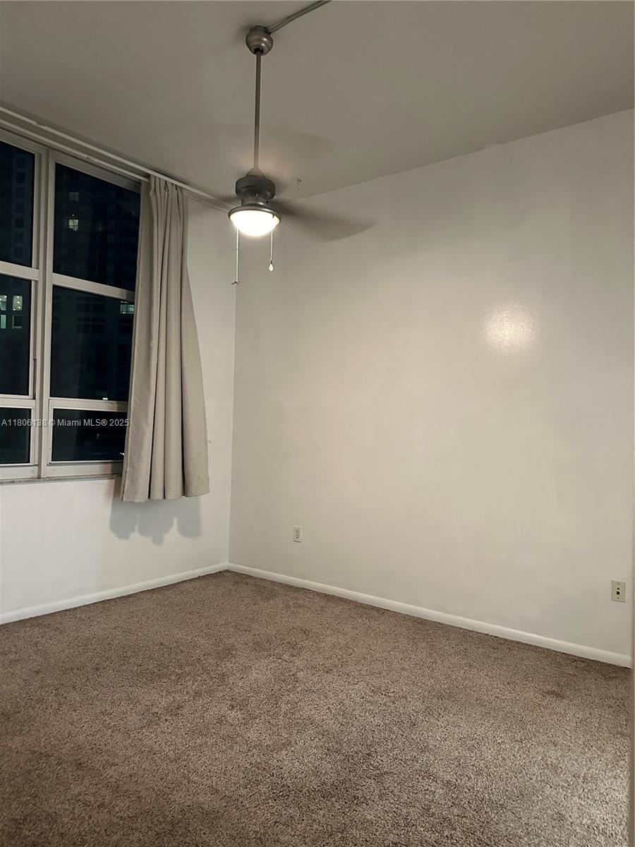 2001 Biscayne Boulevard, Unit 3503 Miami, FL 33137 - Photo 24 of 34 a view of an empty room with a fireplace