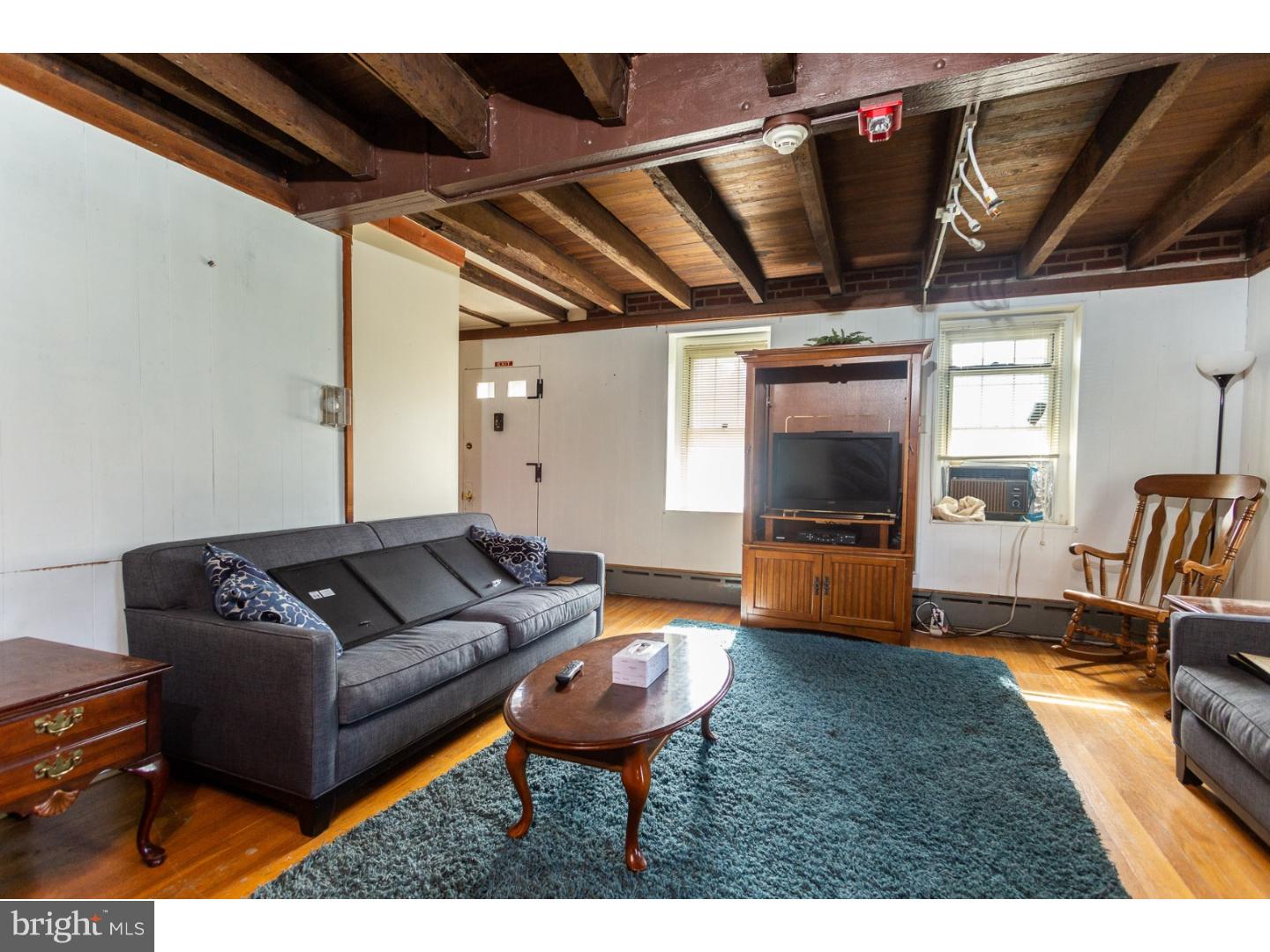 291 New Garden Road Avondale, PA 19311 - Photo 13 of 25 a living room with furniture and a flat screen tv