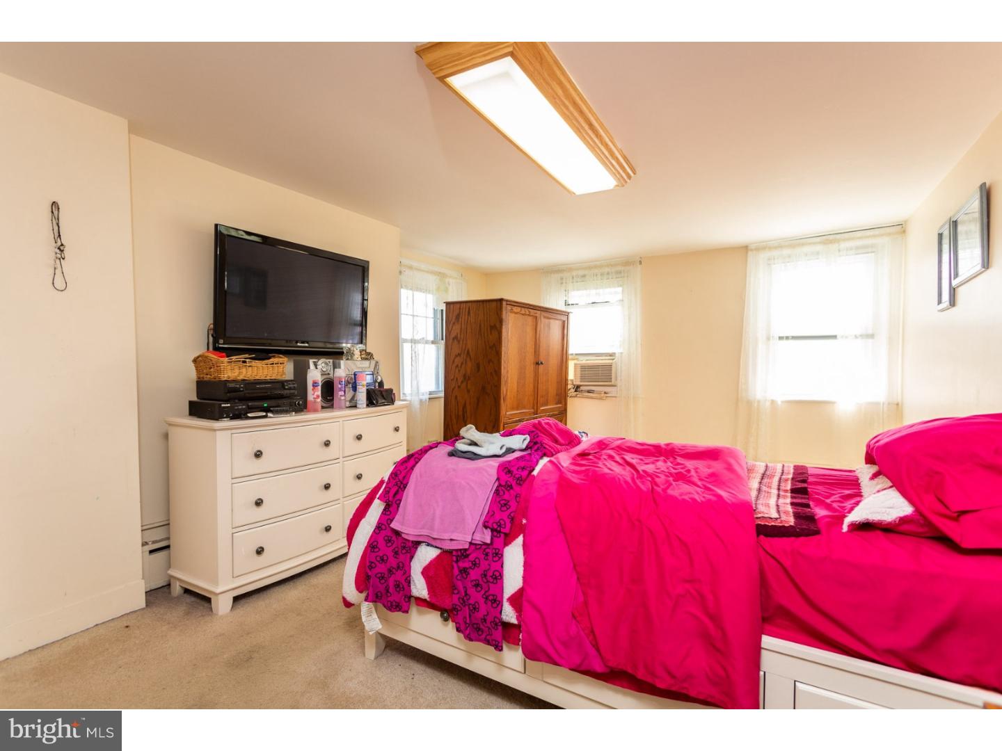 291 New Garden Road Avondale, PA 19311 - Photo 20 of 25 a bedroom with a bed and a flat screen tv