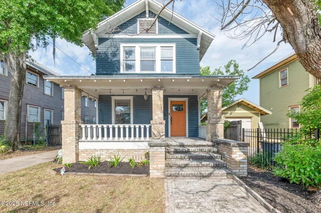a front view of a house with a porch