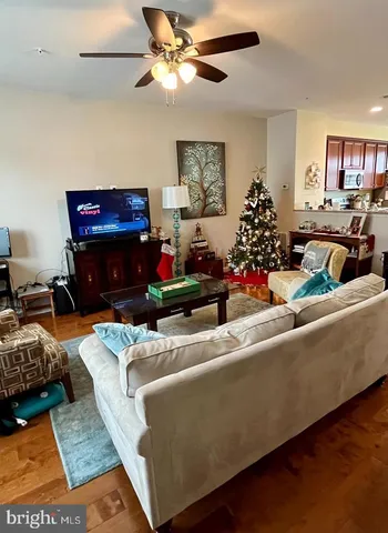 a living room with furniture fireplace and a window