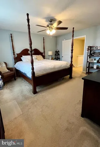 a bedroom with bed and window