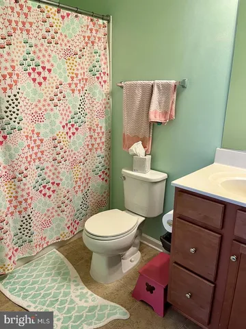 a bathroom with a toilet and a sink