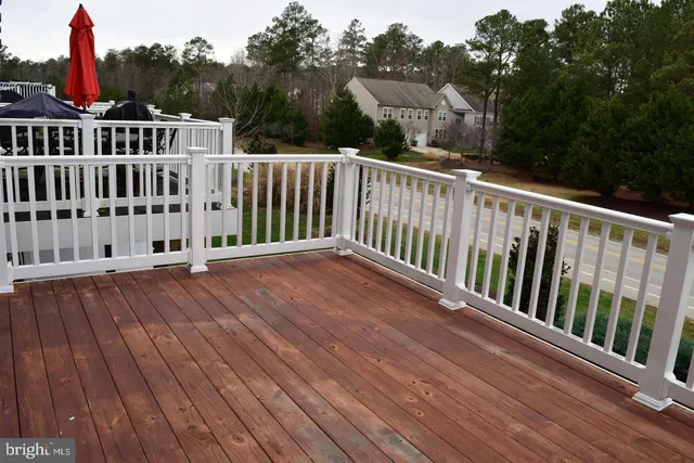 a balcony with wooden floor