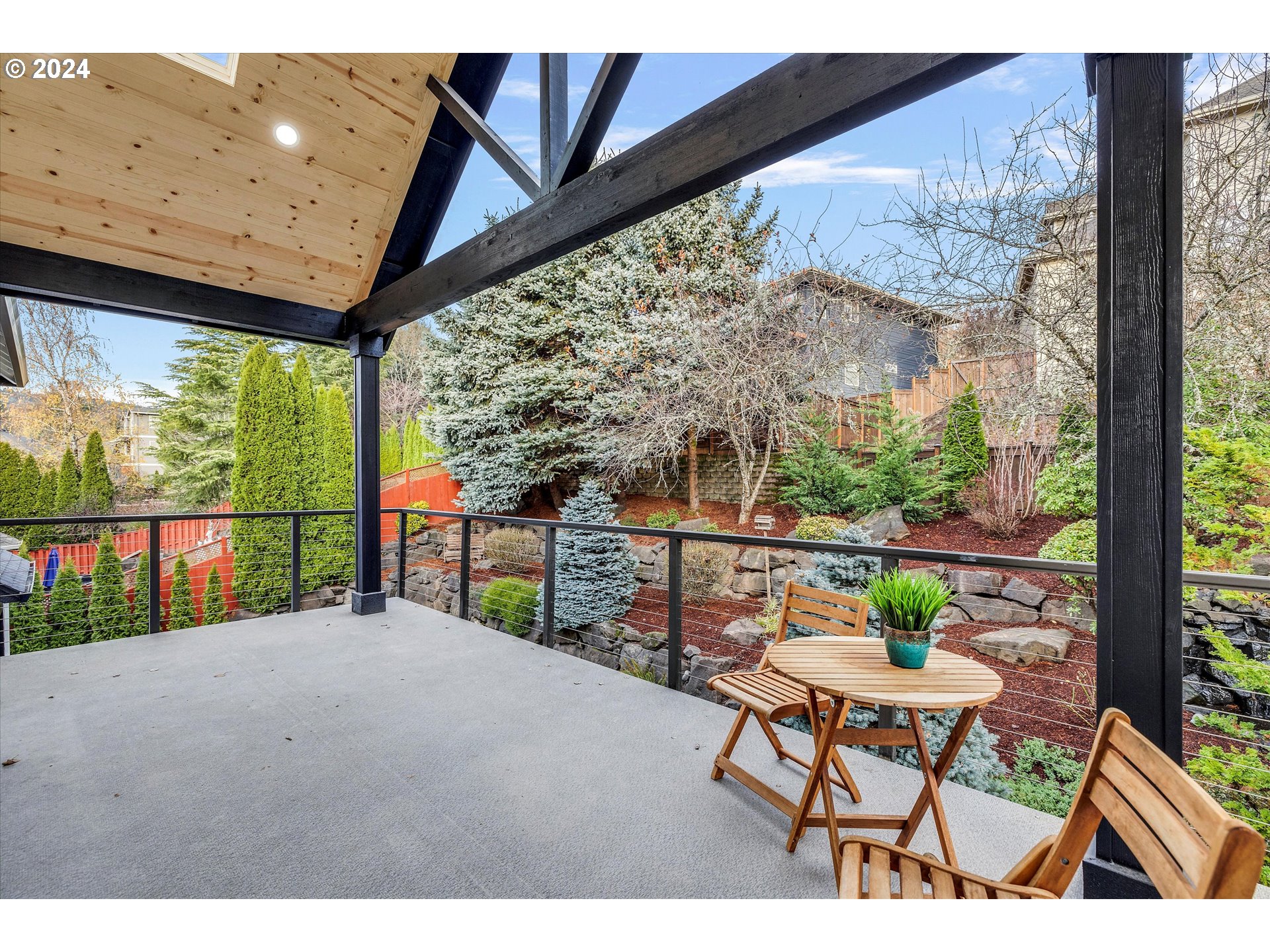 3279 Ridge Pointe Drive Forest Grove, OR 97116 - Photo 35 of 44 a balcony with table and chairs
