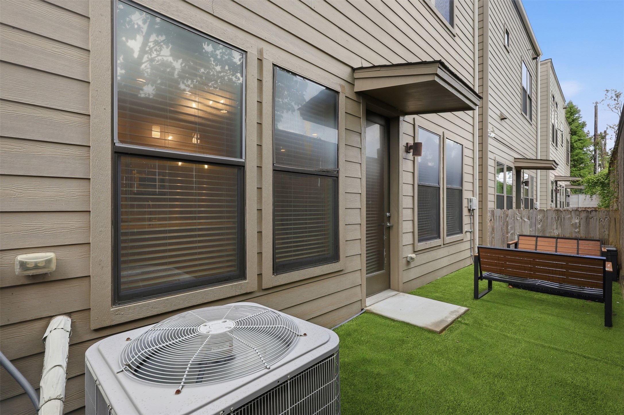 614 Thornton Road, Unit D Houston, TX 77018 - Photo 23 of 32 Another view of the expansive rear patio, featuring low-maintenance artificial turf and ample room for outdoor furnishings.