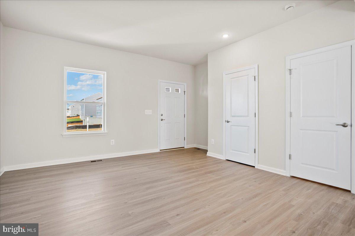 112 Spade End Road Inwood, WV 25428 - Photo 2 of 35 a view of an empty room with wooden floor