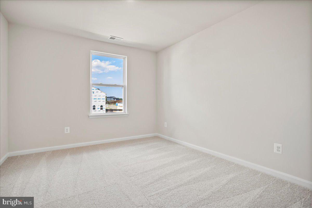 112 Spade End Road Inwood, WV 25428 - Photo 23 of 35 an empty room with windows