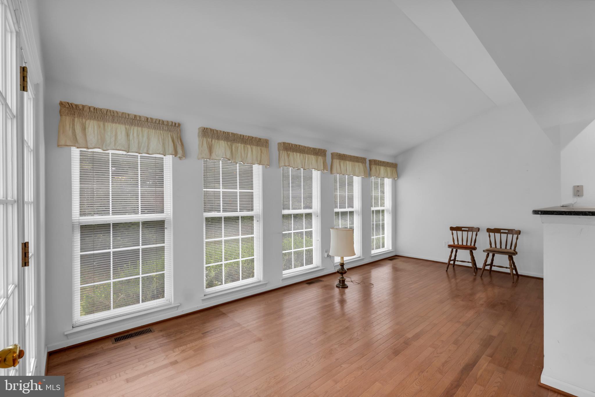 5184 Lovering Drive Doylestown, PA 18902 - Photo 13 of 51 an empty room with wooden floor and windows
