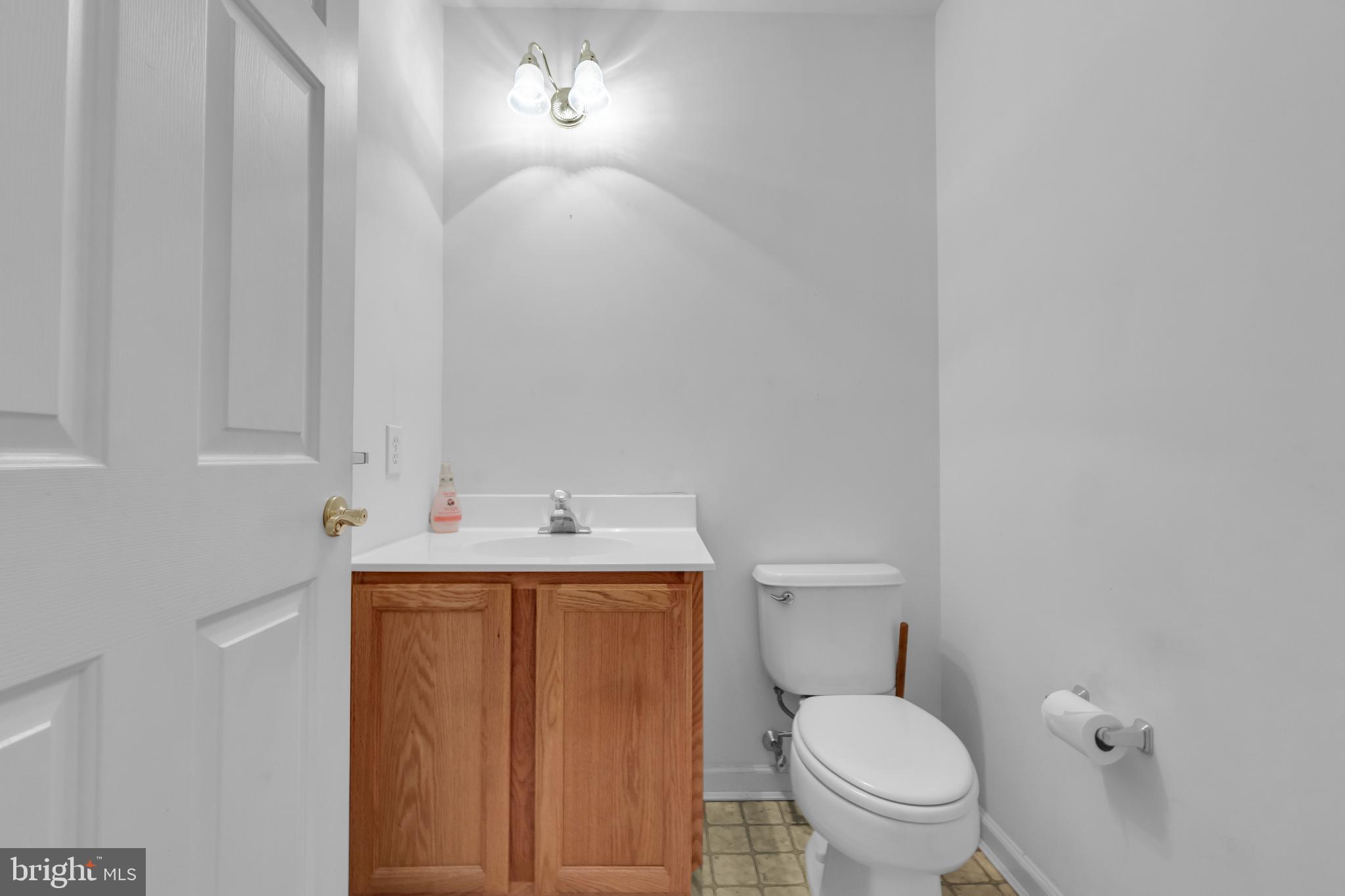 5184 Lovering Drive Doylestown, PA 18902 - Photo 17 of 51 a bathroom with a toilet a sink and mirror