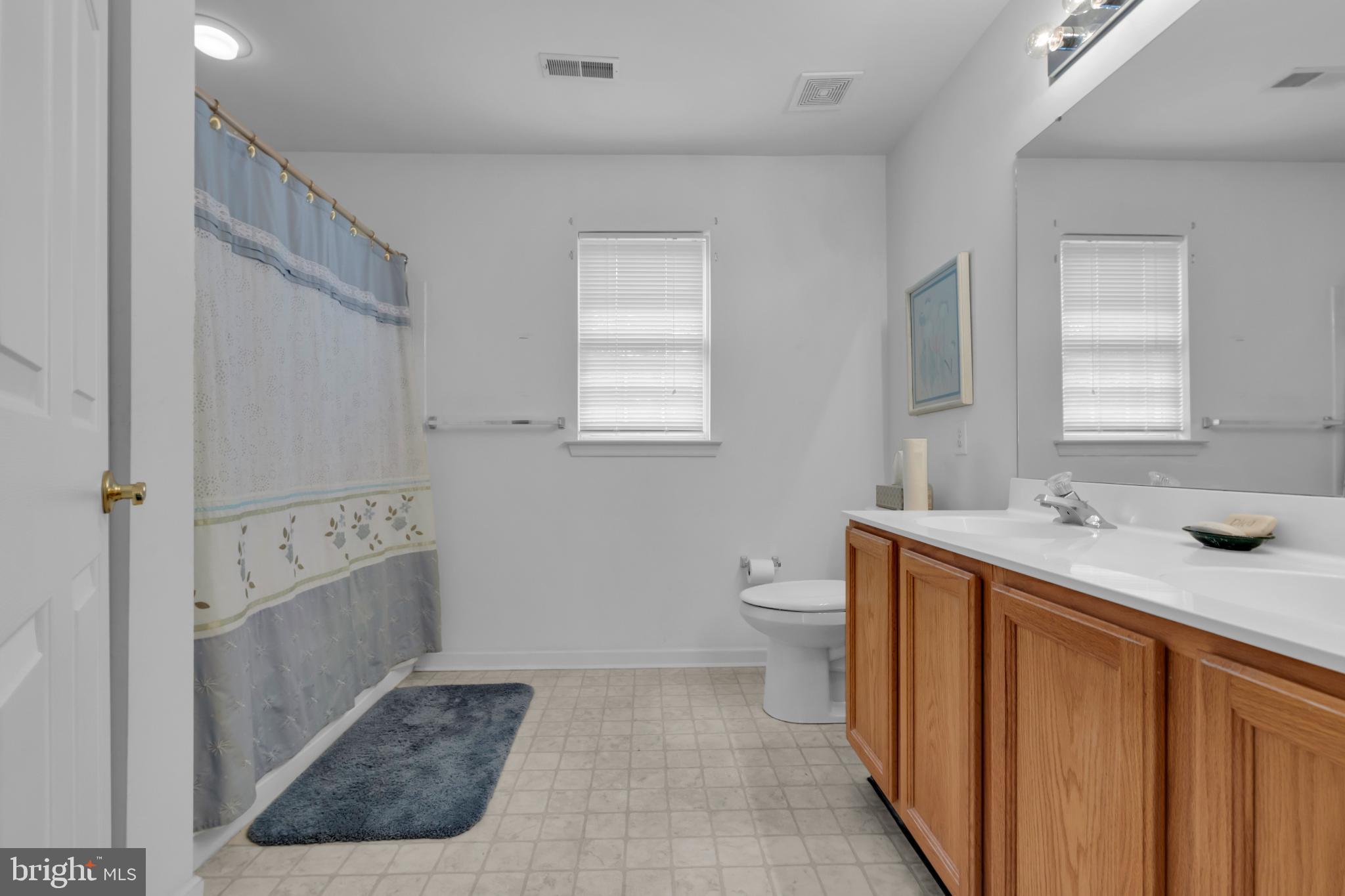 5184 Lovering Drive Doylestown, PA 18902 - Photo 25 of 51 a bathroom with a sink a toilet and shower