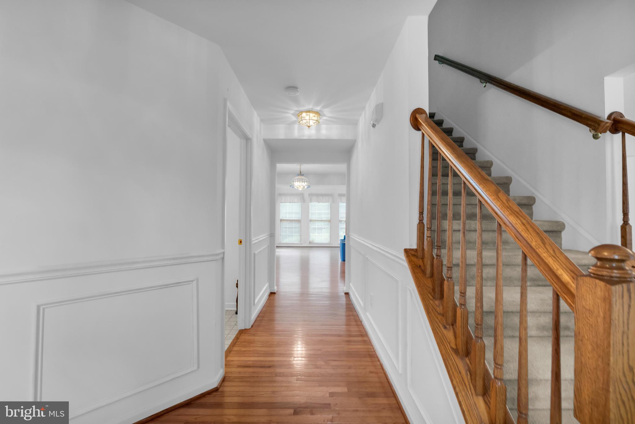 5184 Lovering Drive Doylestown, PA 18902 - Photo 3 of 51 a view of a hallway with wooden floor and staircase