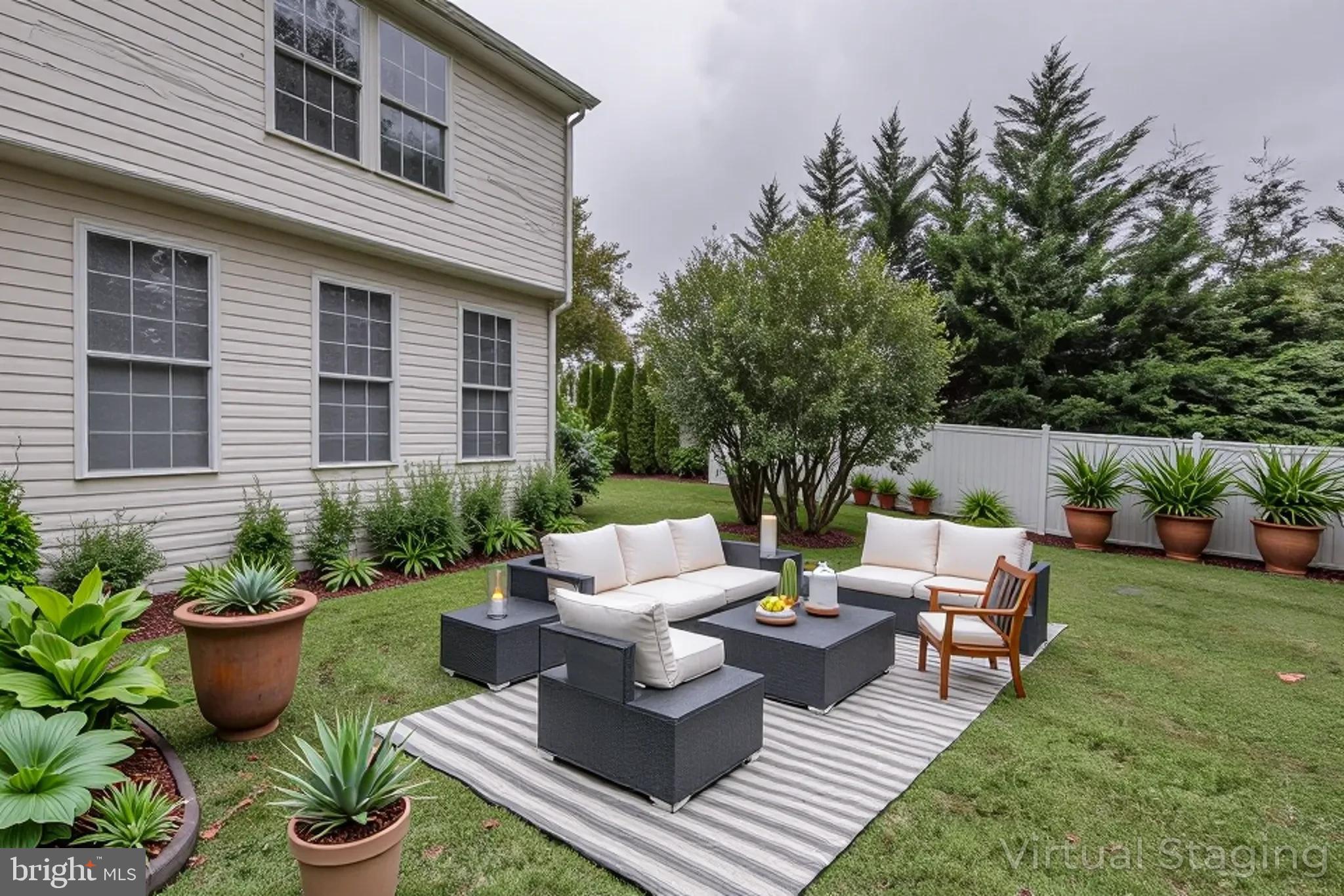 5184 Lovering Drive Doylestown, PA 18902 - Photo 49 of 51 a view of a patio with couches chairs and a potted plant