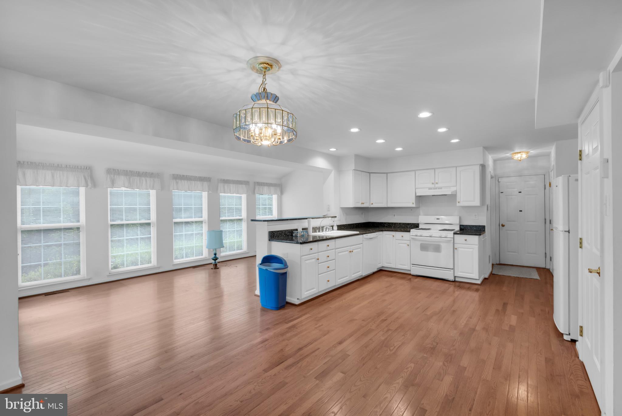 5184 Lovering Drive Doylestown, PA 18902 - Photo 9 of 51 a large kitchen with stainless steel appliances granite countertop a large counter top a sink dishwasher a refrigerator and white cabinets with wooden floor