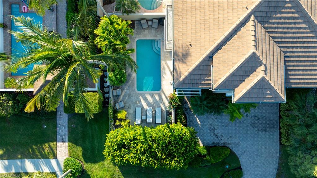 1104 6th Street South, Unit 1 Naples, FL 34102 - Photo 2 of 40 Bird's eye view of a pool area