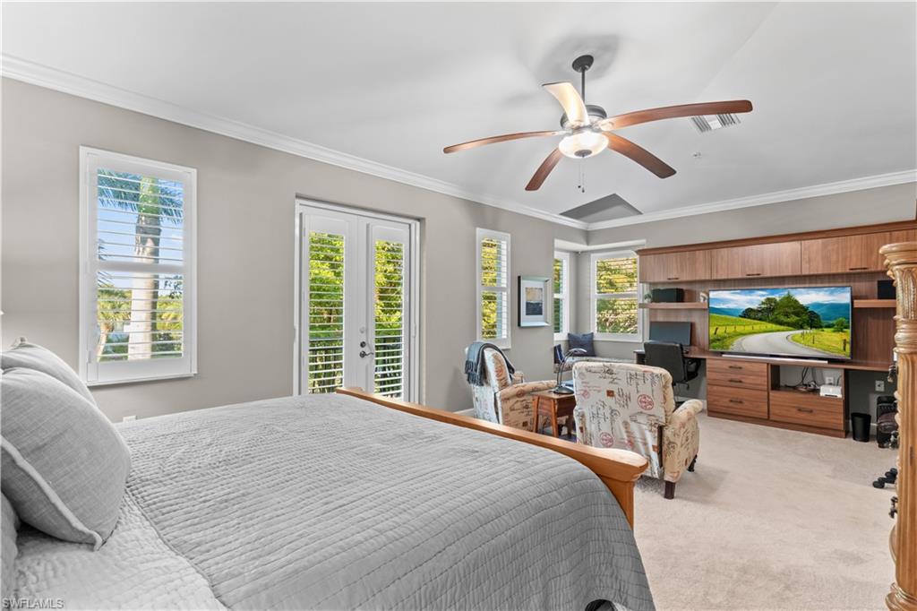 1104 6th Street South, Unit 1 Naples, FL 34102 - Photo 22 of 40 Bedroom with ornamental molding, light colored carpet, access to outside, french doors, and ceiling fan