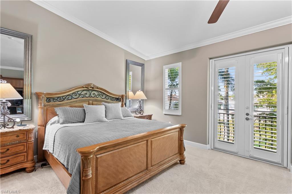 1104 6th Street South, Unit 1 Naples, FL 34102 - Photo 25 of 40 Bedroom featuring light colored carpet, access to outside, ceiling fan, ornamental molding, and french doors