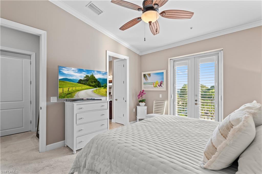 1104 6th Street South, Unit 1 Naples, FL 34102 - Photo 29 of 40 Bedroom featuring crown molding, light colored carpet, ensuite bath, access to exterior, and a ceiling fan