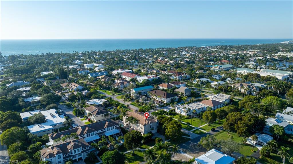 1104 6th Street South, Unit 1 Naples, FL 34102 - Photo 35 of 40 Aerial view of residential area featuring a large body of water