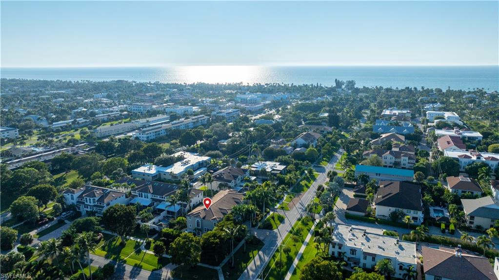 1104 6th Street South, Unit 1 Naples, FL 34102 - Photo 38 of 40 Drone / aerial view of a nearby body of water