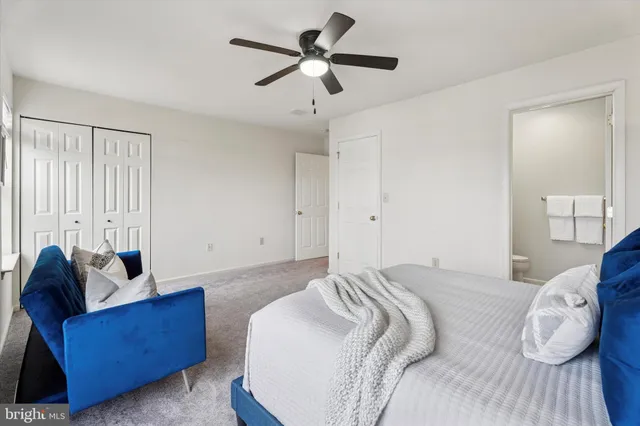 a bed room with a bed and a couch