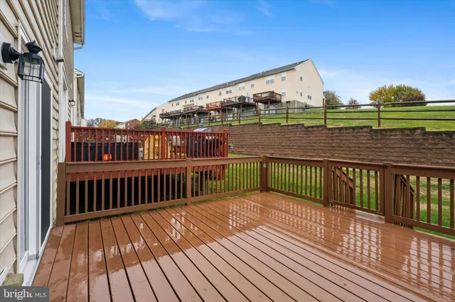 a view of a balcony with wooden floor