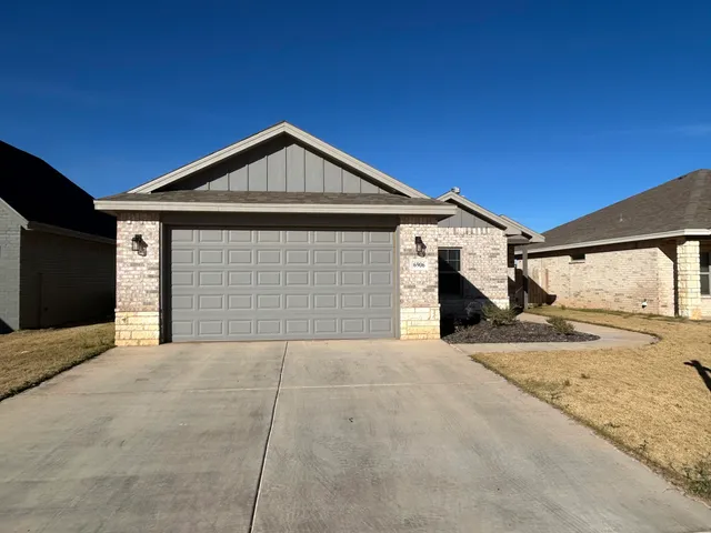 a front view of a house with a garage
