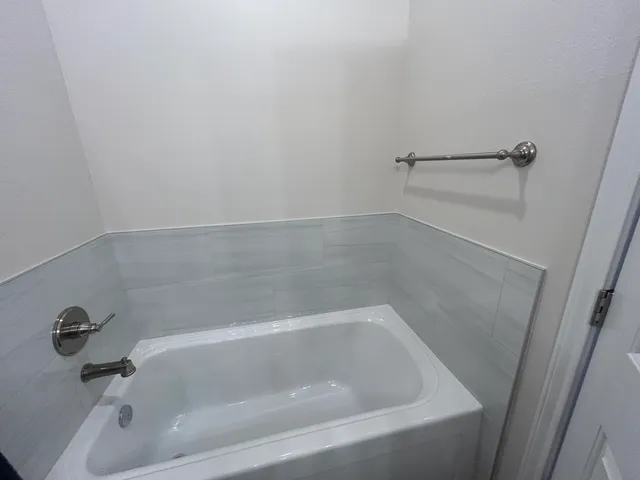 a close view of a bathtub in bathroom
