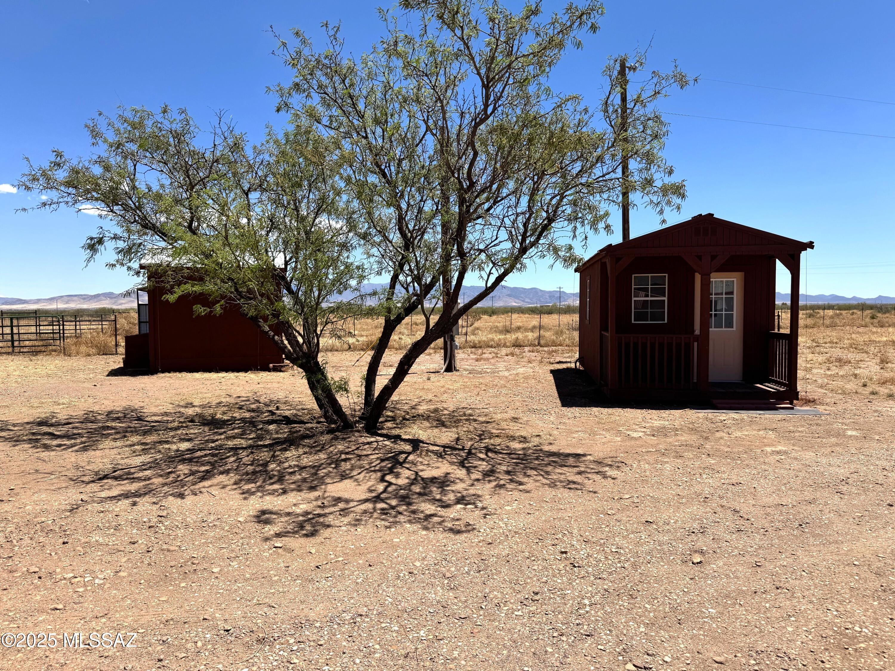 13384 South Cottonwood Road Pearce, AZ 85625 - Photo 42 of 46 a view of a yard covered with snow in front of house