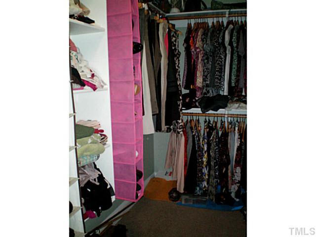 220 Watkins Farm Road Rolesville, NC 27571 - Photo 8 of 25 walk in closet with built in shelves in master bedroom