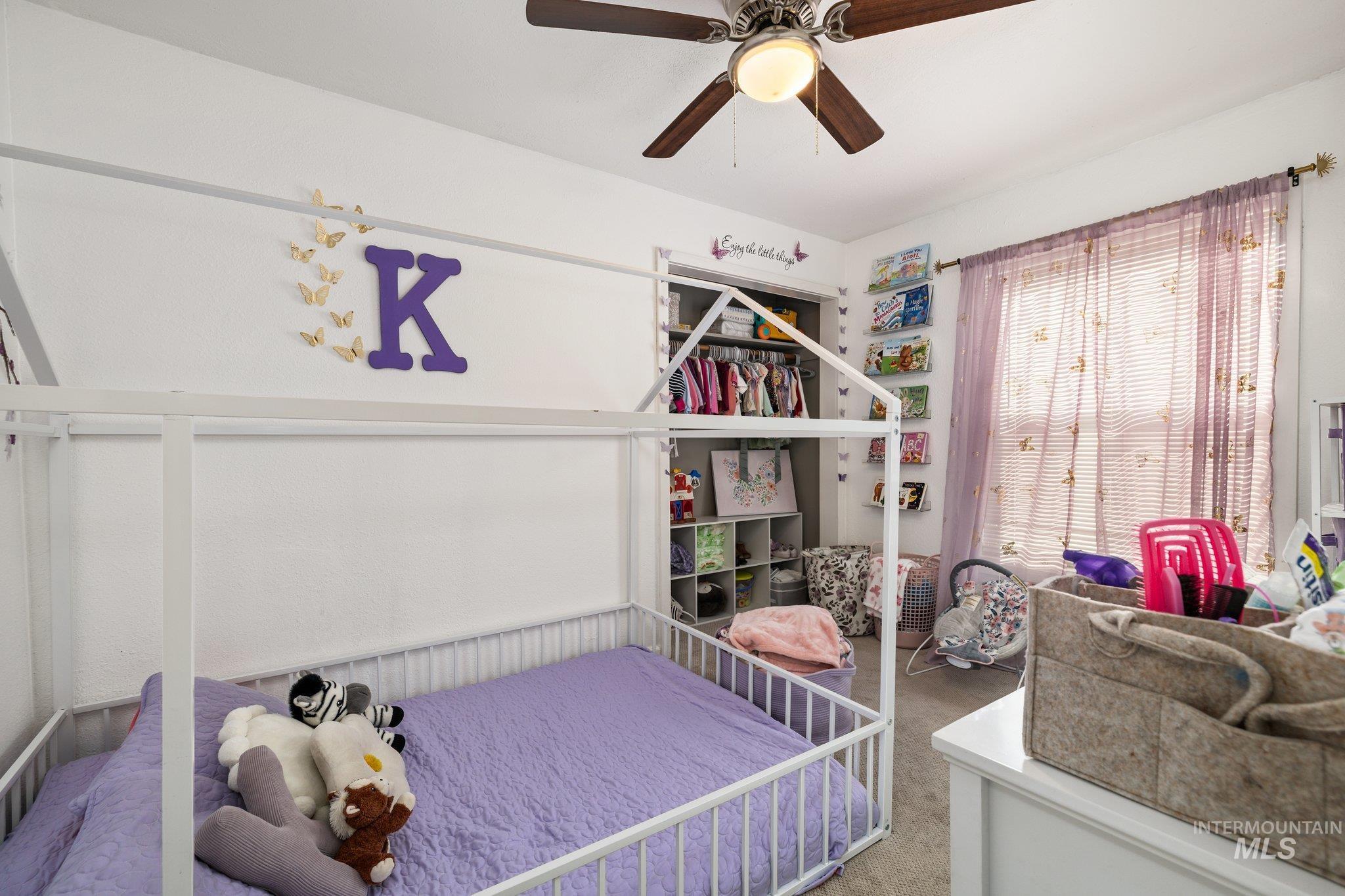 1504 2nd Street North Nampa, ID 83687 - Photo 18 of 29 Bedroom featuring carpet and a ceiling fan
