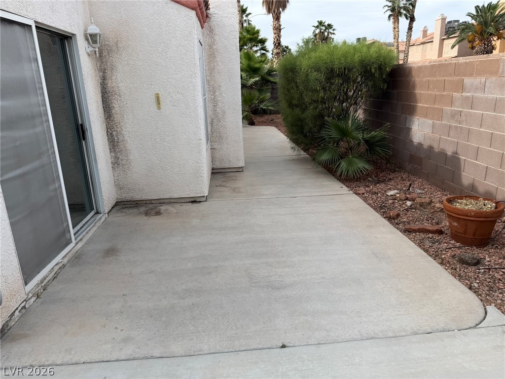 277 Gentle Bay Avenue Henderson, NV 89074 - Photo 13 of 43 This private patio offers a perfect outdoor escape with convenient sliding glass doors.