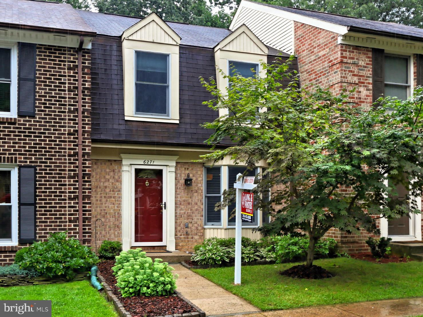 6271 Rathlin Drive Springfield, VA 22152 - Photo 1 of 29 a front view of a house with garden