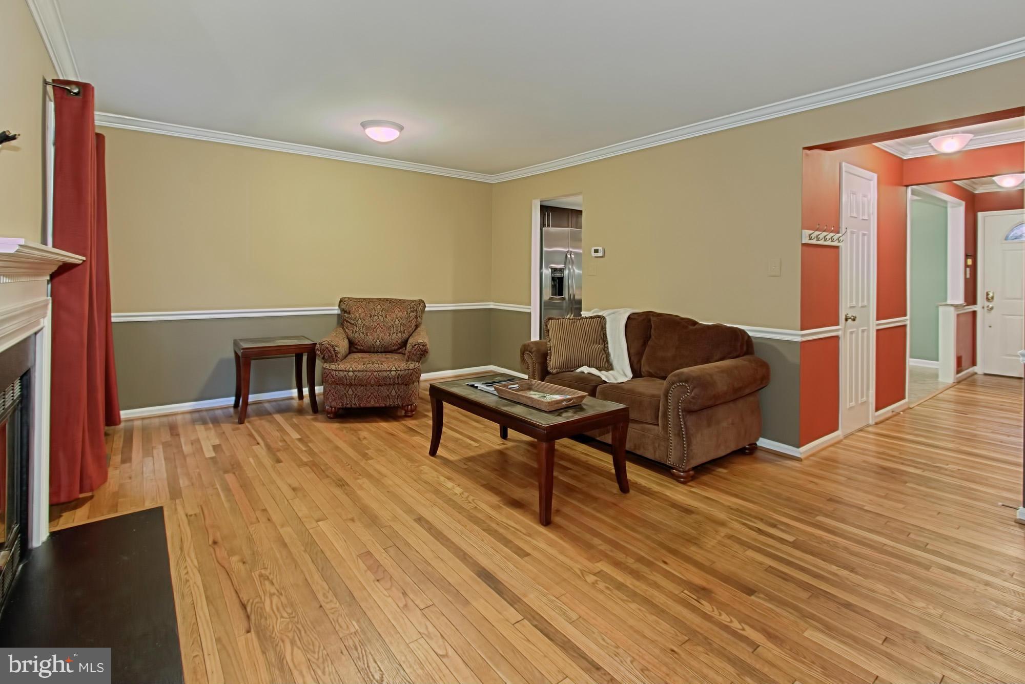 6271 Rathlin Drive Springfield, VA 22152 - Photo 14 of 29 a living room with furniture and a wooden floor