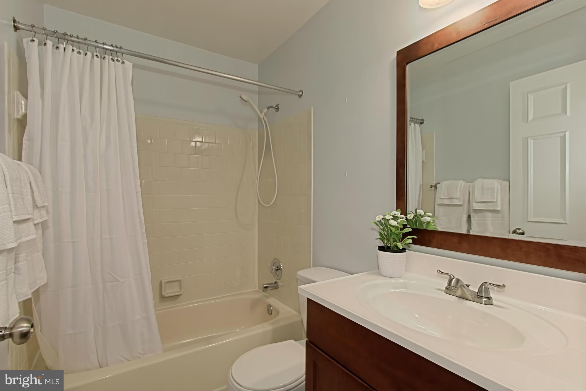 6271 Rathlin Drive Springfield, VA 22152 - Photo 20 of 29 a bathroom with a sink toilet and shower