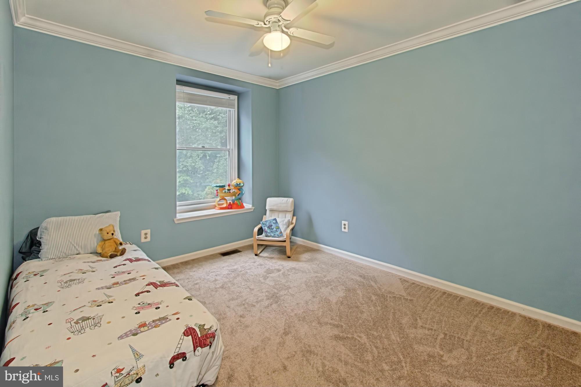 6271 Rathlin Drive Springfield, VA 22152 - Photo 21 of 29 a bedroom with a bed and window