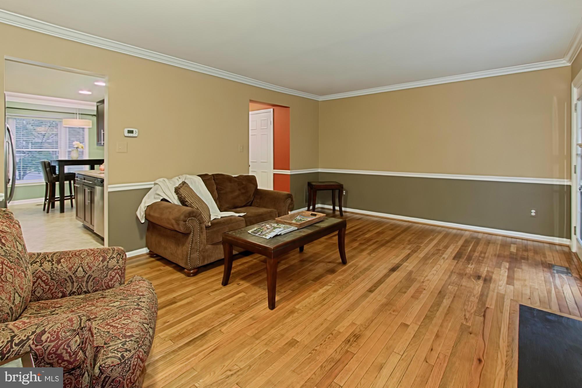 6271 Rathlin Drive Springfield, VA 22152 - Photo 10 of 29 a living room with furniture and a wooden floor
