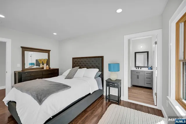 a bedroom with a bed and a couch