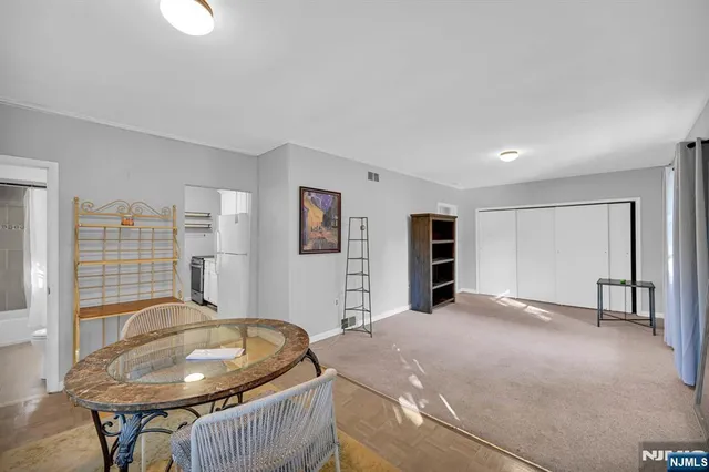 a bedroom with a bed and closet