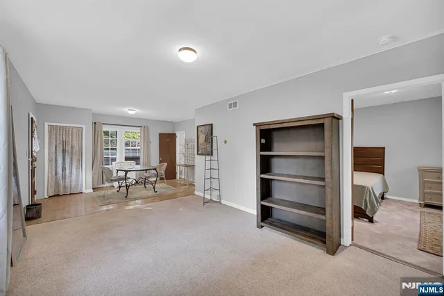 a view of a livingroom with table and chair