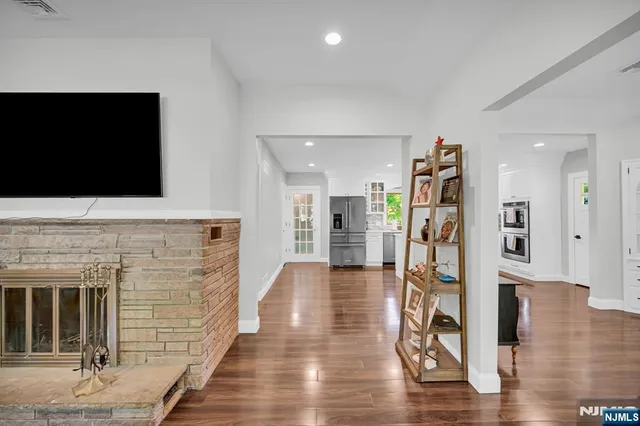 a view of livingroom with hardwood floor and a flat screen tv