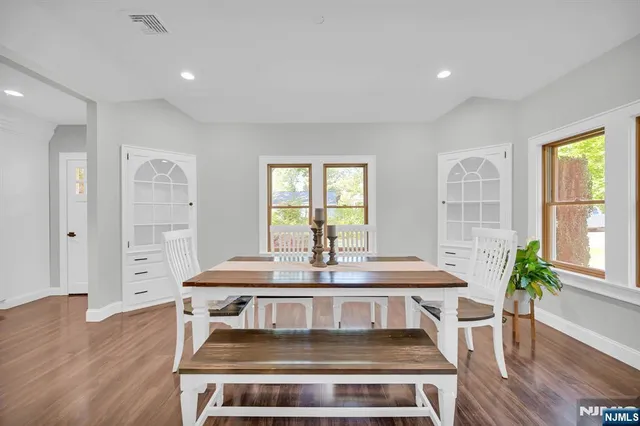 a view of a dining room with furniture window and wooden floor