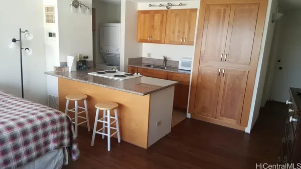 a kitchen that has a sink and a table in it