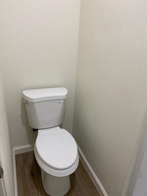 15792 Raymond Road Madera, CA 93638 - Photo 5 of 18 a white toilet sitting next to a white wall