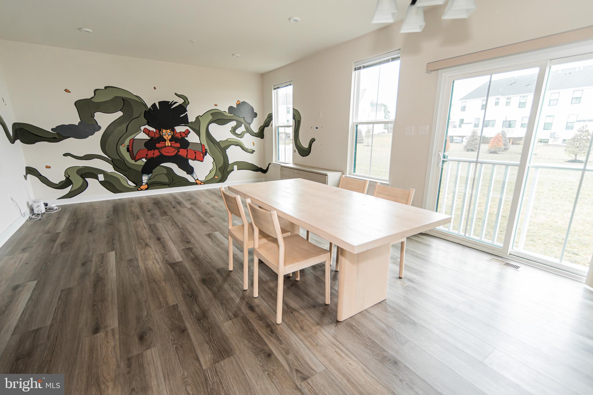 7953 Milltown Circle Cheltenham, PA 19012 - Photo 13 of 24 a view of a dining room with furniture wooden floor and chandelier
